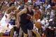 Feb 15, 2014; Clemson, SC, USA; Virginia Cavaliers guard Joe Harris (12) drives to the basket while being defended by Clemson Tigers guard Damarcus Harrison (21) during the first half at J.C. Littlejohn Coliseum. Mandatory Credit: Joshua S. Kelly-USA TODA