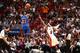 MIAMI, FL - APRIL 6: Iman Shumpert #21 of the New York Knicks shoots against LeBron James #6 of the Miami Heat during a game on April 6, 2014 at American Airlines Arena in Miami, Florida. NOTE TO USER: User expressly acknowledges and agrees that, by down