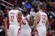 Jan 16, 2014; Houston, TX, USA; Houston Rockets shooting guard James Harden (13) speaks with power forward Dwight Howard (12) and small forward Chandler Parsons (25) during the first quarter against the Oklahoma City Thunder at Toyota Center. Mandatory Cr