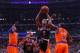 Oct 31, 2013; Chicago, IL, USA; Chicago Bulls point guard Derrick Rose (center) leaps between New York Knicks small forward Carmelo Anthony (left) and point guard Raymond Felton (right) during the second half at the United Center. Chicago won 82-81. Manda
