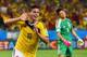 CUIABA, BRAZIL - JUNE 24: James Rodriguez of Colombia celebrates scoring his team's fourth goal past goalkeeper Eiji Kawashima of Japan during the 2014 FIFA World Cup Brazil Group C match between Japan and Colombia at Arena Pantanal on June 24, 2014 in C