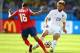 BELO HORIZONTE, BRAZIL - JUNE 24: Cristian Gamboa of Costa Rica challenges Luke Shaw of England during the 2014 FIFA World Cup Brazil Group D match between Costa Rica and England at Estadio Mineirao on June 24, 2014 in Belo Horizonte, Brazil. (Photo by R