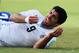NATAL, BRAZIL - JUNE 24: Luis Suarez of Uruguay reacts after a clash during the 2014 FIFA World Cup Brazil Group D match between Italy and Uruguay at Estadio das Dunas on June 24, 2014 in Natal, Brazil. (Photo by Matthias Hangst/Getty Images)