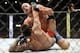 Jun 7, 2014; Albuquerque, NM, USA; Patrick Cummins (red) and Roger Narvaez (blue) fight during their light heavyweight bout during UFC Fight Night 42 at Tingley Coliseum. Cummins won via second round stoppage. Mandatory Credit: Joe Camporeale-USA TODAY Sp