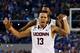 ARLINGTON, TX - APRIL 07: Shabazz Napier #13 of the Connecticut Huskies celebrates on the court after defeating the Kentucky Wildcats 60-54 in the NCAA Men's Final Four Championship at AT&T Stadium on April 7, 2014 in Arlington, Texas. (Photo by Ronald