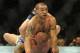 Jul 6, 2013; Las Vegas, NV, USA; Cub Swanson (red gloves) and Dennis Siver (blue gloves) during their Featherweight Bout at the MGM Grand Garden Arena. Swanson won. Mandatory Credit: Jayne Kamin-Oncea-USA TODAY Sports