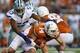 AUSTIN, TX - SEPTEMBER 21: David Ash #14 of the Texas Longhorns is tackled by Blake Slaughter #53 of the Kansas State Wildcats at Darrell K Royal-Texas Memorial Stadium on September 21, 2013 in Austin, Texas. (Photo by Ronald Martinez/Getty Images)