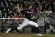Jun 23, 2014; Omaha, NE, USA; Vanderbilt Commodores pitcher Adam Ravenelle (12) throws against the Virginia Cavaliers during game one of the College World Series Finals at TD Ameritrade Park Omaha. Vanderbilt won 9-8. Mandatory Credit: Bruce Thorson-USA T