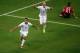 MANAUS, BRAZIL - JUNE 22: Clint Dempsey of the United States celebrates scoring his team's second goal with teammate Michael Bradley as Joao Pereira of Portugal looks on during the 2014 FIFA World Cup Brazil Group G match between the United States and Por