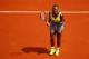 PARIS, FRANCE - MAY 25: Serena Williams of the United States celebrates a point during her women's singles match against Alize Lim of France on day one of the French Open at Roland Garros on May 25, 2014 in Paris, France. (Photo by Clive Brunskill/Getty
