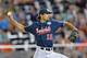 Omaha, NE - JUNE 23: Pitcher Adam Ravenelle #12 of the Vanderbilt Commodores delivers a pitch against the Virginia Cavaliers in the ninth inning during game one of the College World Series Championship on June 23, 2014 at TD Ameritrade Park in Omaha, Neb