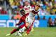 FORTALEZA, BRAZIL - JUNE 21: Toni Kroos of Germany controls the ball against Sulley Muntari of Ghana during the 2014 FIFA World Cup Brazil Group G match between Germany and Ghana at Castelao on June 21, 2014 in Fortaleza, Brazil. (Photo by Martin Rose/Ge