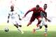 BRASILIA, BRAZIL - JUNE 26: Cristiano Ronaldo of Portugal is challenged by Harrison Afful of Ghana during the 2014 FIFA World Cup Brazil Group G match between Portugal and Ghana at Estadio Nacional on June 26, 2014 in Brasilia, Brazil. (Photo by Adam Pr