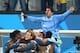 Jun 19, 2014; Sao Paulo, BRAZIL; Uruguay forward Luis Suarez (9) is lifted by his teammates as they celebrate following the game against England during the 2014 World Cup at Arena Corinthians. Uruguay defeated England 2-1. Mandatory Credit: Mark J. Rebil