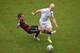 RECIFE, BRAZIL - JUNE 26: Philipp Lahm of Germany challenges Michael Bradley of the United States during the 2014 FIFA World Cup Brazil group G match between the United States and Germany at Arena Pernambuco on June 26, 2014 in Recife, Brazil. (Photo by