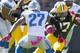 Oct 6, 2013; Green Bay, WI, USA; Green Bay Packers running back Eddie Lacy (27) runs with the ball as Detroit Lions safety Glover Quin (27) defends during the first quarter at Lambeau Field. Mandatory Credit: Jeff Hanisch-USA TODAY Sports