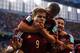 CURITIBA, BRAZIL - JUNE 26: Alexander Kokorin of Russia celebrates scoring his team's first goal with teammate Oleg Shatov on his back during the 2014 FIFA World Cup Brazil Group H match between Algeria and Russia at Arena da Baixada on June 26, 2014 in