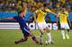 CUIABA, BRAZIL - JUNE 24: Toshihiro Aoyama of Japan tackles James Rodriguez of Colombia during the 2014 FIFA World Cup Brazil Group C match between Japan and Colombia at Arena Pantanal on June 24, 2014 in Cuiaba, Brazil. (Photo by Adam Pretty/Getty Imag