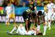 SAO PAULO, BRAZIL - JUNE 26: Moussa Dembele of Belgium and Hwang Seok-Ho of South Korea console Kim Young-Gwon after the 2014 FIFA World Cup Brazil Group H match between South Korea and Belgium at Arena de Sao Paulo on June 26, 2014 in Sao Paulo, Brazil.