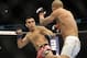 Jan 26, 2013; Chicago, IL, USA; Ricardo Lamas (red and black shorts) fights against Erik Koch (white shorts) during UFC on FOX 6 at the United Center. Mandatory Credit: David Banks-USA TODAY Sports