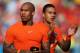 SAO PAULO, BRAZIL - JUNE 23: Nigel de Jong (L) and Memphis Depay of the Netherlands thank the fans after victory in the 2014 FIFA World Cup Brazil Group B match between the Netherlands and Chile at Arena de Sao Paulo on June 23, 2014 in Sao Paulo, Brazil