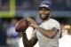 Sep 8, 2013; Arlington, TX, USA; Miami Heat guard LeBron James throws a football on the sidelines of the game between the Dallas Cowboys and the New York Giants at AT&T Stadium. Mandatory Credit: Tim Heitman-USA TODAY Sports