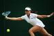 LONDON, ENGLAND - JUNE 26: Jie Zheng of China plays a forehand return during her Ladies' Singles second round match against Ana Ivanovic of Serbia on day four of the Wimbledon Lawn Tennis Championships at the All England Lawn Tennis and Croquet Club at W