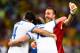 FORTALEZA, BRAZIL - JUNE 24: (L-R) Konstantinos Manolas, Vasilis Torosidis and Panagiotis Glykos of Greece celebrate after defeating the Ivory Coast 2-1 during the 2014 FIFA World Cup Brazil Group C match between Greece and the Ivory Coast at Castelao on
