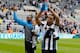 NEWCASTLE, ENGLAND- May 03: Loic Remy (R) and Shola Ameobi (L) of Newcastle during a lap of honour after the Barclays Premier League match between Newcastle United and Cardiff City at St. James' Park on May 03, 2014 in Newcastle upon Tyne, England. (Ph