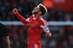 SOUTHAMPTON, ENGLAND - DECEMBER 22: Adam Lallana of Southampton celebrates after scoring the opening goal during the Barclays Premier League match between Southampton and Tottenham Hotspur at St Mary's Stadium on December 22, 2013 in Southampton, England