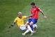 BELO HORIZONTE, BRAZIL - JUNE 28: Dani Alves of Brazil tackles Eugenio Mena of Chile during the 2014 FIFA World Cup Brazil round of 16 match between Brazil and Chile at Estadio Mineirao on June 28, 2014 in Belo Horizonte, Brazil. (Photo by Ian Walton/Ge