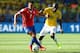 BELO HORIZONTE, BRAZIL - JUNE 28: Alexis Sanchez of Chile and Ramires of Brazil compete for the ball during the 2014 FIFA World Cup Brazil round of 16 match between Brazil and Chile at Estadio Mineirao on June 28, 2014 in Belo Horizonte, Brazil. (Photo