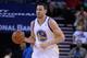 Apr 6, 2014; Oakland, CA, USA; Golden State Warriors center Andrew Bogut (12) dribbles the ball against the Utah Jazz during the first quarter at Oracle Arena. The Warriors defeated the Jazz 130-102. Mandatory Credit: Kyle Terada-USA TODAY Sports