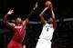BROOKLYN, NY - MAY 12: Andray Blatche #0 of the Brooklyn Nets shoots against Chris Bosh #1 of the Miami Heat in Game Four of the Eastern Conference Semifinals during the 2014 NBA Playoffs on May 12, 2014 at Barclays Center in Brooklyn. NOTE TO USER: User