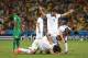 FORTALEZA, BRAZIL - JUNE 24: Giorgos Samaras of Greece (ground) celebrates with teammates Vasilis Torosidis, Sokratis Papastathopoulos and Dimitris Salpingidis after being awarded a penalty as Giovanni Sio of the Ivory Coast reacts during the 2014 FIFA Wo
