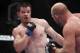 Oct 19, 2013; Houston, TX, USA; Tim Boetsch (red gloves) fights against C.B. Dollaway (blue gloves) in their middleweight bout during UFC 166 at Toyota Center. Mandatory Credit: Andrew Richardson-USA TODAY Sports