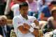 LONDON, ENGLAND - JUNE 27: Novak Djokovic of Serbia clutches his shoulder which he injured after a fall during his Gentlemen's Singles third round match against Gilles Simon of France on day five of the Wimbledon Lawn Tennis Championships at the All Engl