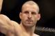 SINGAPORE - JANUARY 04: Tarec Saffiedine reacts as he enters the arena during the UFC Fight Night Singapore welterweight bout at Marina Bay Sands on January 4, 2014 in Singapore. (Photo by Suhaimi Abdullah/Getty Images)
