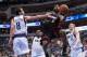 Feb 18, 2014; Dallas, TX, USA; Miami Heat small forward LeBron James (6) drives to the basket past Dallas Mavericks point guard Jose Calderon (8) and power forward Dirk Nowitzki (41) during the second half at the American Airlines Center. James leads his