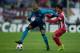 MADRID, SPAIN - DECEMBER 11: Fernando Reges (L) of FC Porto competes for the ball with Oliver Torres (R) of Atletico de Madrid during the UEFA Champions League Group G match at Vicente Calderon Stadium on December 11, 2013 in Madrid, Spain. (Photo by Go