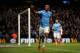 MANCHESTER, ENGLAND - DECEMBER 14: Fernandinho of Manchester City celebrates scoring their fifth goal past Wojciech Szczesny of Arsenal during the Barclays Premier League match between Manchester City and Arsenal at Etihad Stadium on December 14, 2013 in