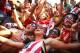 RIO DE JANEIRO, BRAZIL - JUNE 26: U.S. supporters celebrate advancing to the Round of 16 after their loss to Germany while watching the match at FIFA Fan Fest on June 26, 2014 in Rio de Janeiro, Brazil. The U.S. lost 1-0 but still advance to the knockout