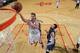 HOUSTON, TX - NOVEMBER 23: Chandler Parsons #25 of the Houston Rockets shoots the ball against Kevin Love #42 of the Minnesota Timberwolves on November 23, 2013 at the Toyota Center in Houston, Texas. NOTE TO USER: User expressly acknowledges and agrees
