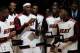 MIAMI, FL - OCTOBER 30: (L) Dwyane Wade #3 of the Miami Heat, (C) Chris Bosh #1 of the Miami Heat and (R) LeBron James #6 of the Miami Heat look at their 2012 NBA Championship rings following a ring giving ceremony prior to the game against the Boston Ce