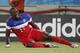 Jun 16, 2014; Natal, Rio Grande do Norte, BRAZIL; United States forward Jozy Altidore (17) grabs his leg in pain while falling to the ground during the first half of their 2014 World Cup game against Ghana at Estadio das Dunas. Mandatory Credit: Winslow T