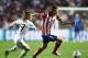 LISBON, PORTUGAL - MAY 24: Filipe Luis of Club Atletico de Madrid takes on Luka Modric of Real Madrid during the UEFA Champions League Final between Real Madrid and Atletico de Madrid at Estadio da Luz on May 24, 2014 in Lisbon, Portugal. (Photo by Laur