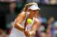 LONDON, ENGLAND - JULY 01: Angelique Kerber of Germany plays a backhand return during her Ladies' Singles fourth round match against Maria Sharapova of Russia on day eight of the Wimbledon Lawn Tennis Championships at the All England Lawn Tennis and Croq