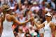 LONDON, ENGLAND - JULY 01: Angelique Kerber of Germany shakes hands with Maria Sharapova of Russia after their Ladies' Singles fourth round match on day eight of the Wimbledon Lawn Tennis Championships at the All England Lawn Tennis and Croquet Club on J