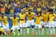 BELO HORIZONTE, BRAZIL - JUNE 28: (L-R) Thiago Silva, Luiz Gustavo, Ramires, Dani Alves, Jo, Marcelo, Hulk, Willian and Neymar of Brazil celebrate after defeating Chile in a penalty shootout during the 2014 FIFA World Cup Brazil round of 16 match between
