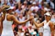 LONDON, ENGLAND - JULY 01: Angelique Kerber of Germany shakes hands with Maria Sharapova of Russia after their Ladies' Singles fourth round match on day eight of the Wimbledon Lawn Tennis Championships at the All England Lawn Tennis and Croquet Club on J
